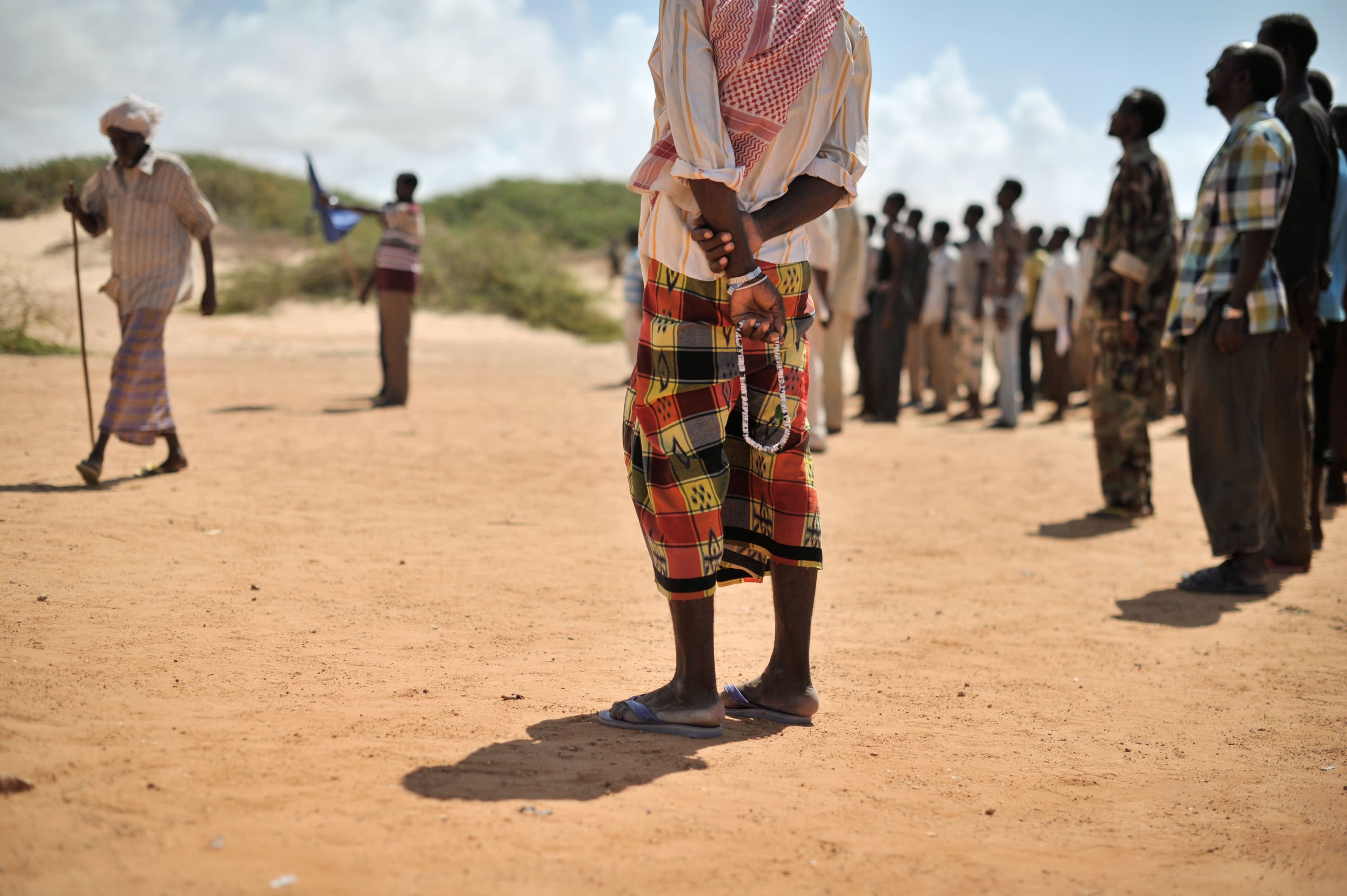 Somali elders smiling together in a welcoming group setting